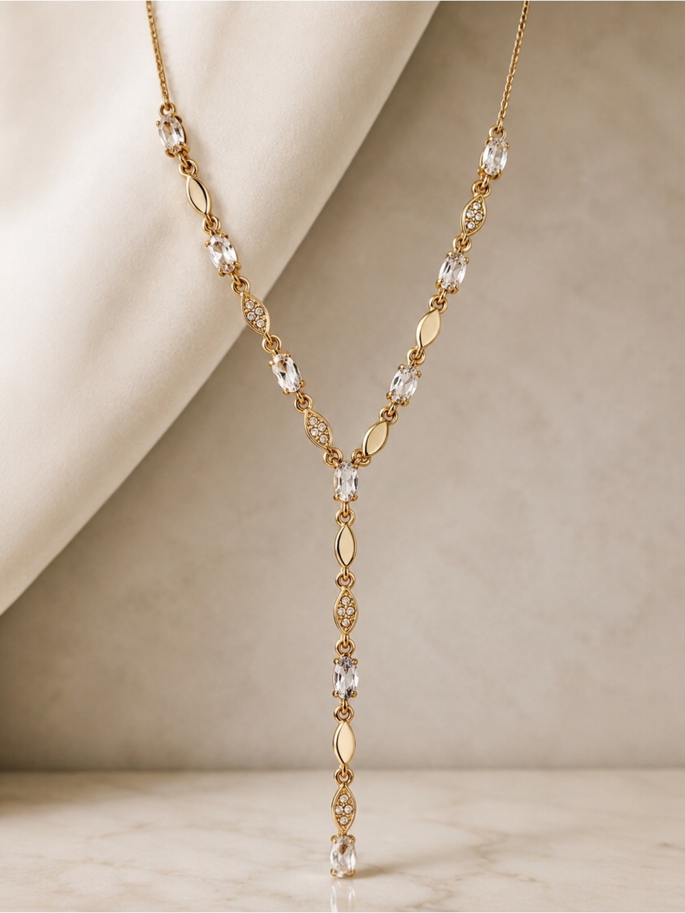 Givenchy linear crystal necklace in gold.